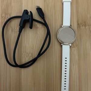 Garmin White and Gold Smartwatch with Black Charging Cable